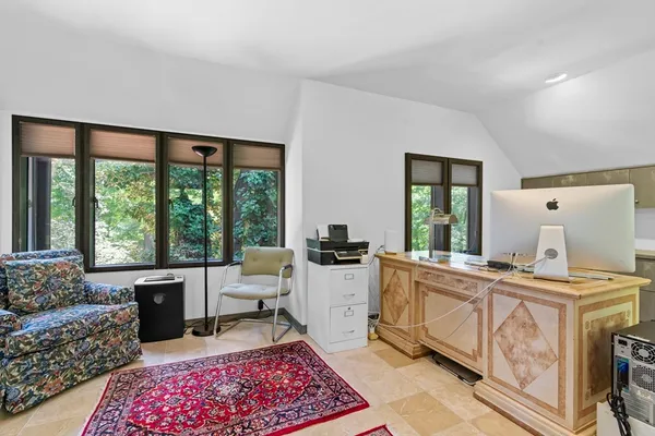 a view of a hallway with living room and furniture