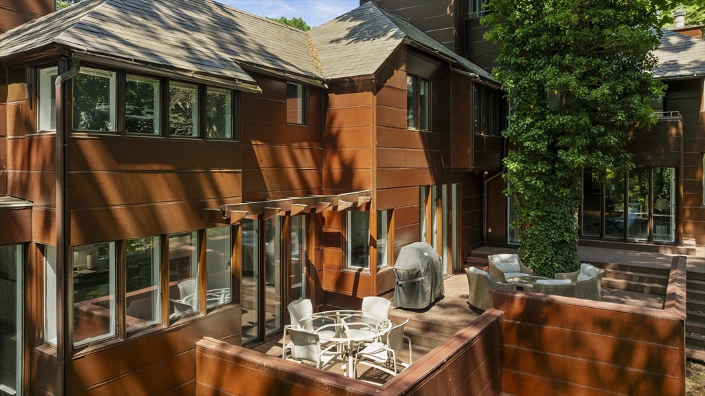 331 Heath Street Brookline, MA 02467 - Photo 27 of 31 a view of balcony with chairs and potted plants