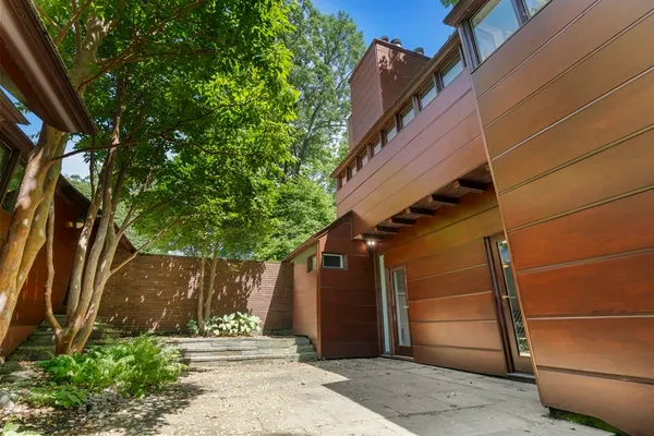 a backyard of a house with lots of green space