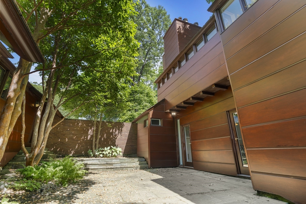 331 Heath Street Brookline, MA 02467 - Photo 29 of 31 a front view of a house with a tree