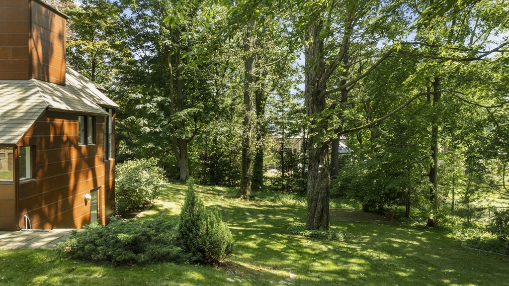 331 Heath Street Brookline, MA 02467 - Photo 31 of 31 a backyard of a house with lots of green space