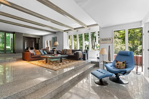 a dining room with furniture and window