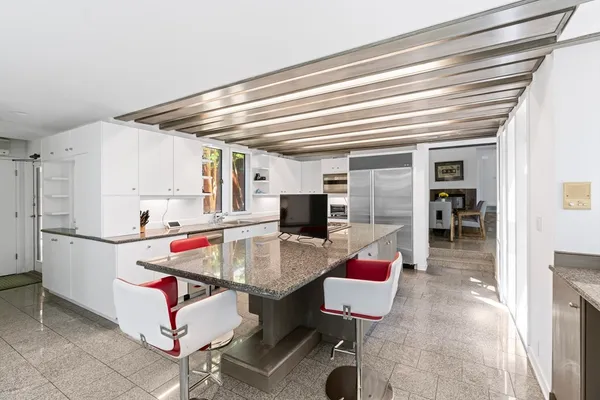 a kitchen with a stove and a sink