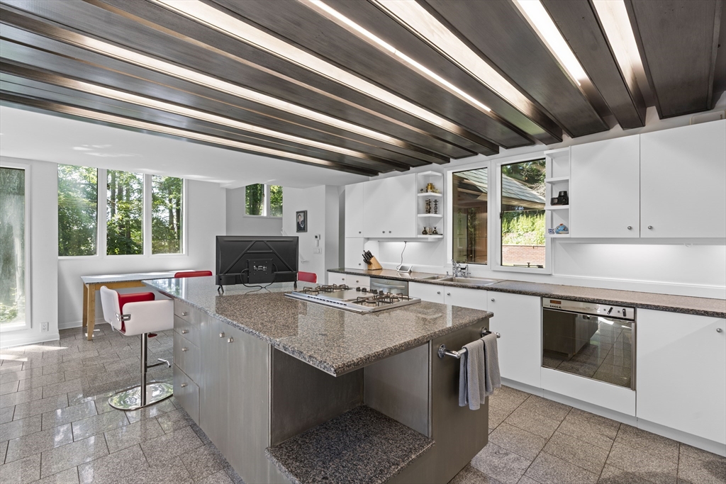 331 Heath Street Brookline, MA 02467 - Photo 10 of 31 a kitchen with a stove and a sink