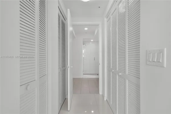a view of a hallway with washer and dryer