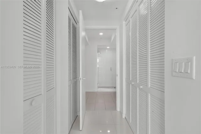 a view of a hallway with washer and dryer