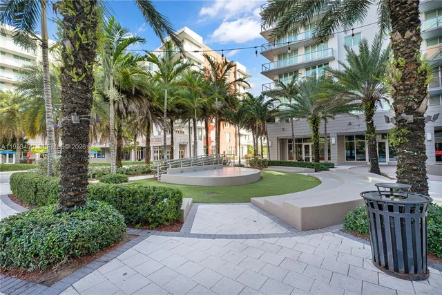 a kitchen with stainless steel appliances kitchen island a large counter top and oven