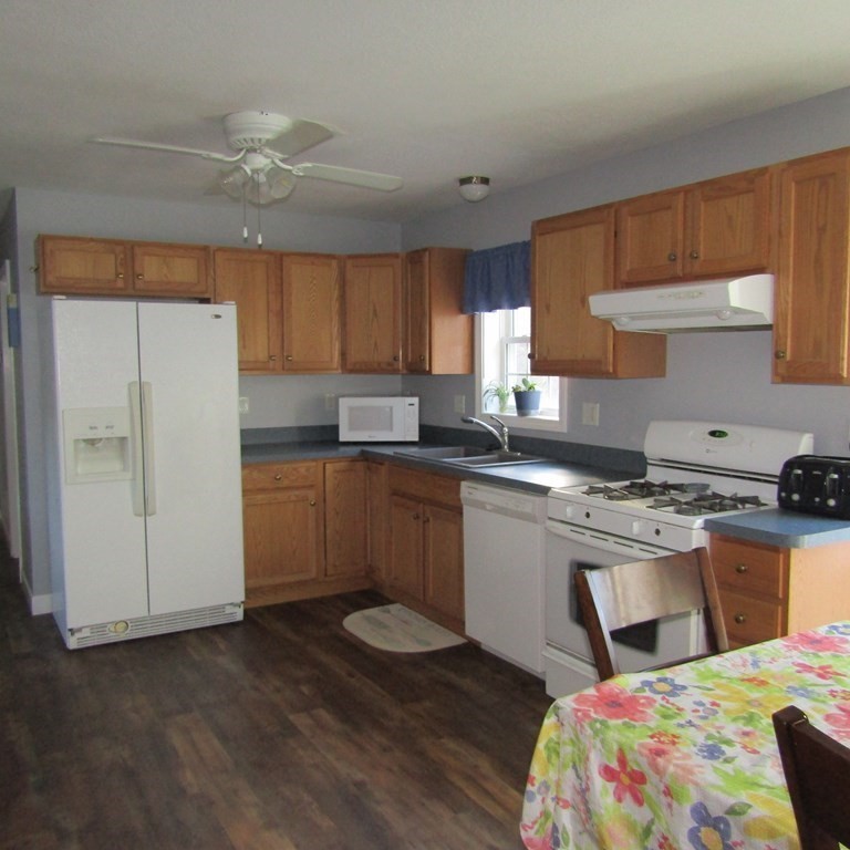 16 Chesterfield Road Northampton, MA 01053 - Photo 10 of 42 a kitchen with a stove a sink and a refrigerator