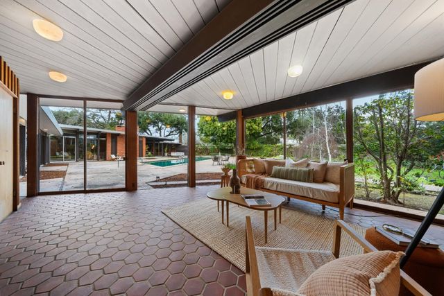 a bed room with a bed and a large window