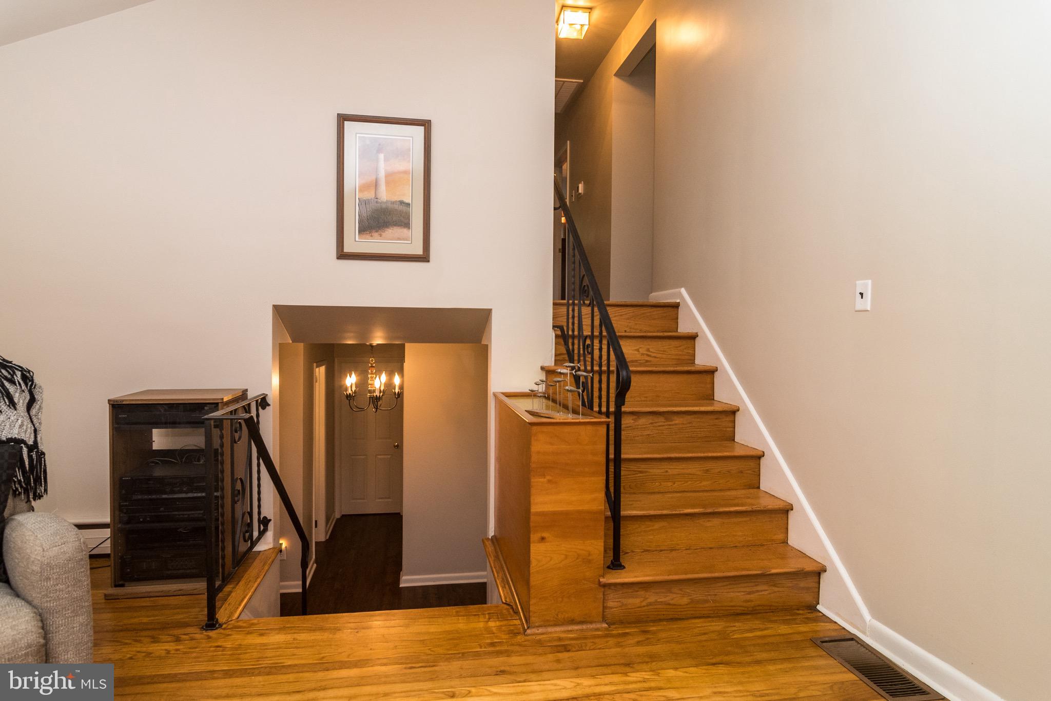 93 Buttonwood Lane Doylestown, PA 18901 - Photo 19 of 35 Living room stairs to bedrooms and to lower level