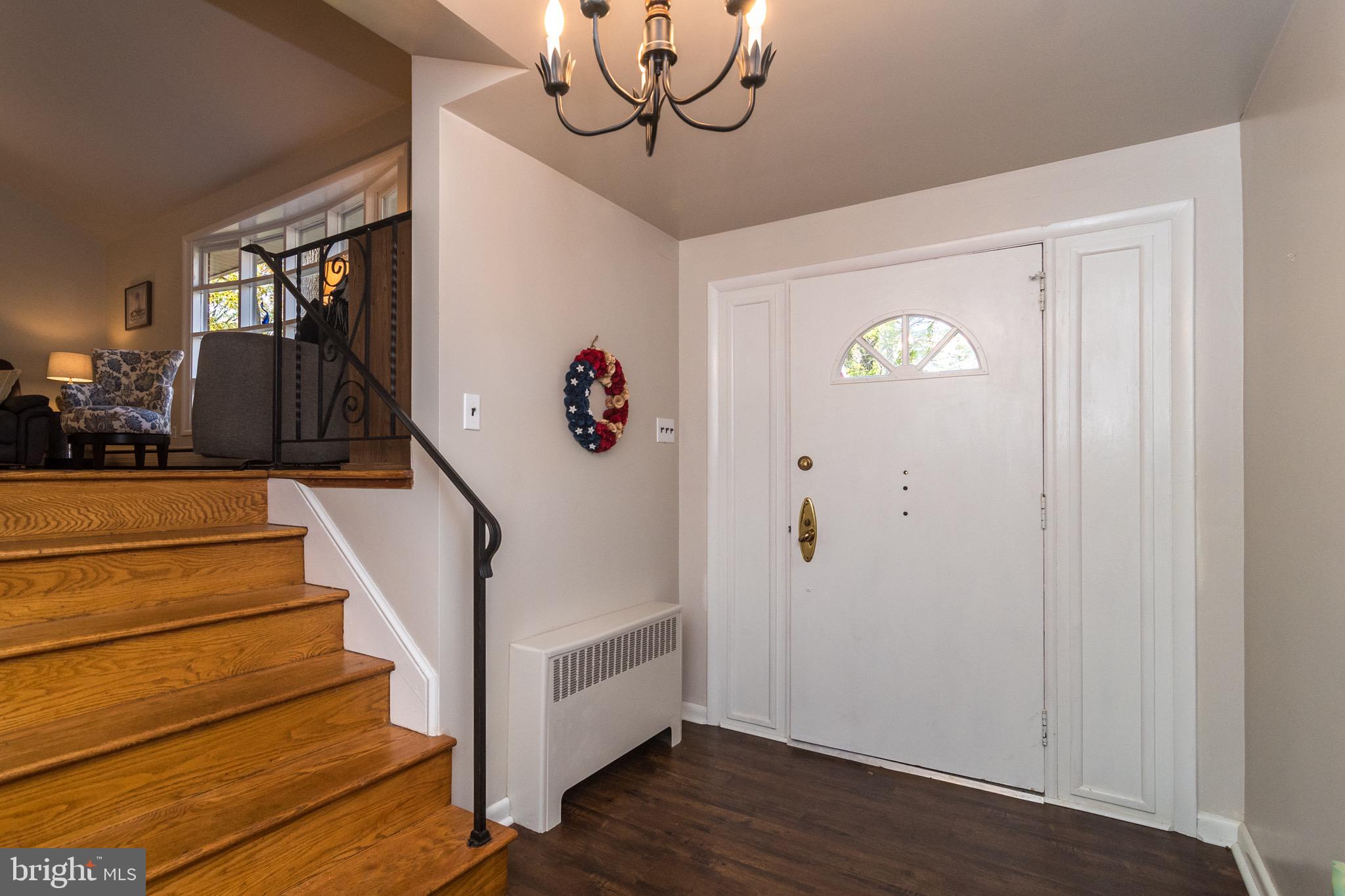 93 Buttonwood Lane Doylestown, PA 18901 - Photo 5 of 35 Foyer to grand LR&DR. Gleaming orig red oak floors