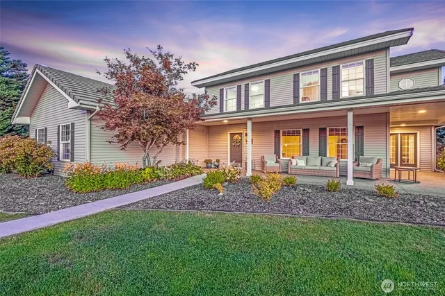 a view of a house with a yard and plants
