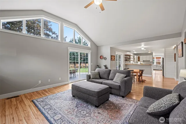a living room with furniture and a rug
