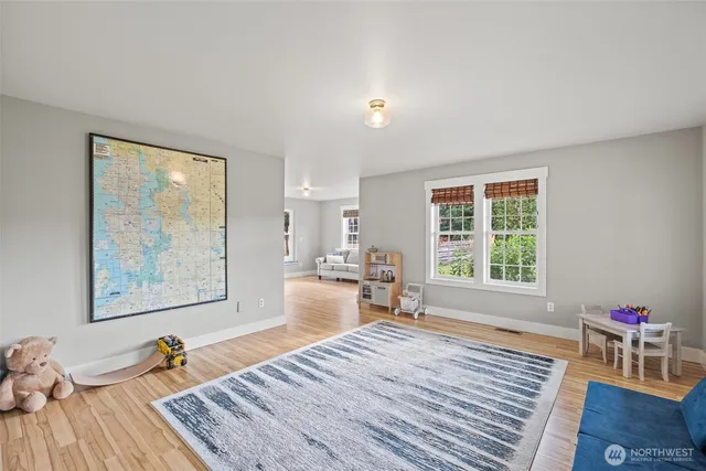 a bedroom with furniture and a window