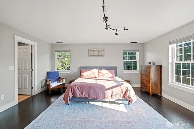 a bed room with a bed and a window