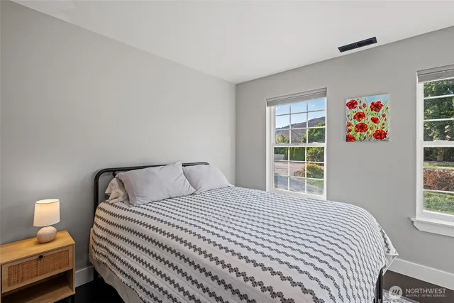 a bedroom with a bed and window