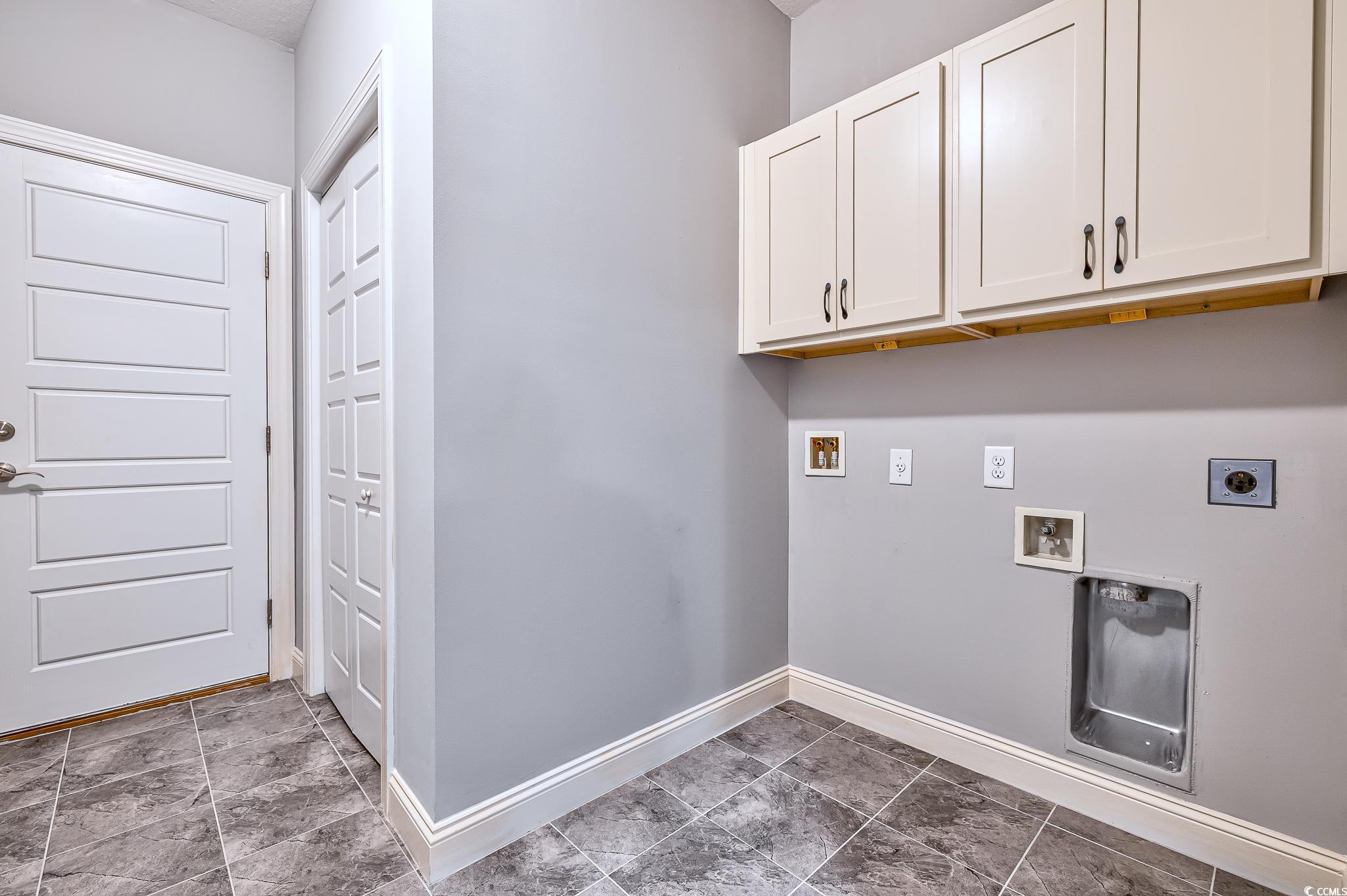 648 Sunnyside Drive, Unit 102 Murrells Inlet, SC 29576 - Photo 12 of 21 Laundry room with electric dryer hookup, cabinet space, hookup for a washing machine, and baseboards