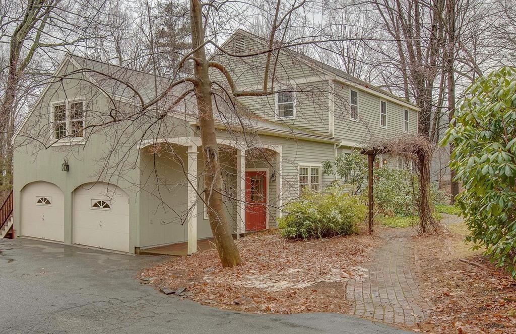 250 Old Littleton Road Harvard, MA 01451 - Photo 1 of 35 a view of a white house with a tree and a yard