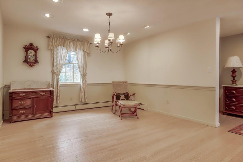 250 Old Littleton Road Harvard, MA 01451 - Photo 15 of 35 a living room with furniture and a chandelier