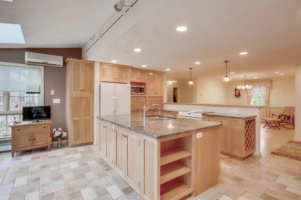 250 Old Littleton Road Harvard, MA 01451 - Photo 19 of 35 a kitchen with stainless steel appliances granite countertop a sink a stove a refrigerator and a oven