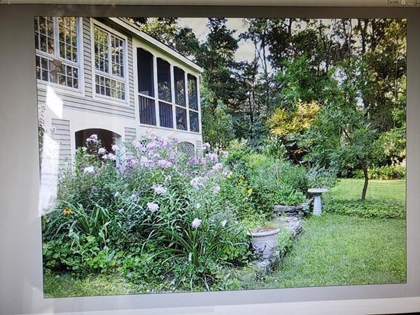 250 Old Littleton Road Harvard, MA 01451 - Photo 2 of 35 a front view of a house with garden