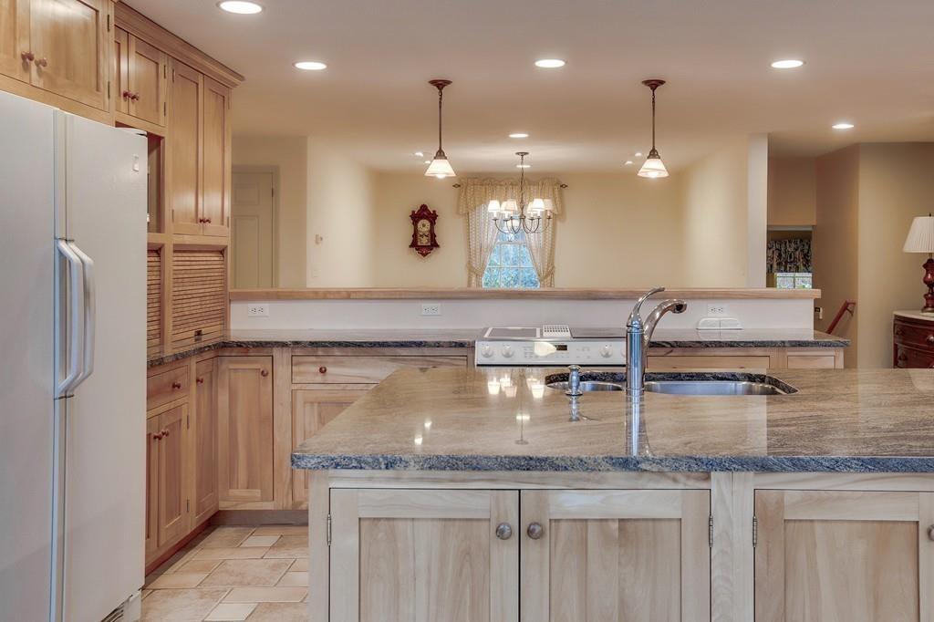 250 Old Littleton Road Harvard, MA 01451 - Photo 21 of 35 a kitchen with kitchen island a sink stainless steel appliances and counter space