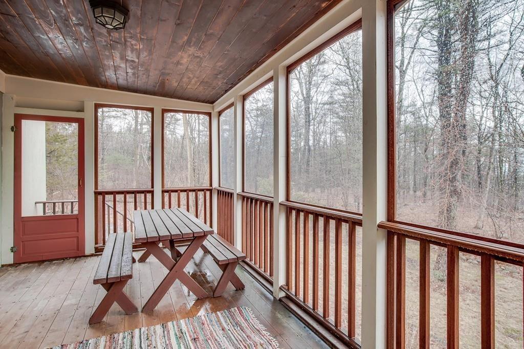 250 Old Littleton Road Harvard, MA 01451 - Photo 22 of 35 a view of staircase with furniture and floor to ceiling window