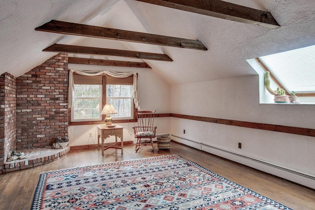 250 Old Littleton Road Harvard, MA 01451 - Photo 24 of 35 a living room with a couch and a table