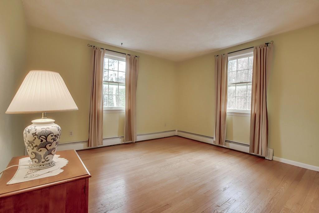 250 Old Littleton Road Harvard, MA 01451 - Photo 28 of 35 a view of a livingroom with wooden floor and a window