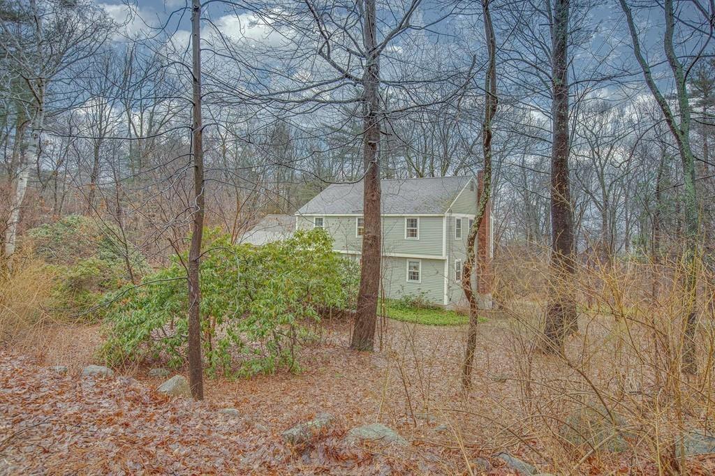 250 Old Littleton Road Harvard, MA 01451 - Photo 8 of 35 a backyard of a house with lots of green space