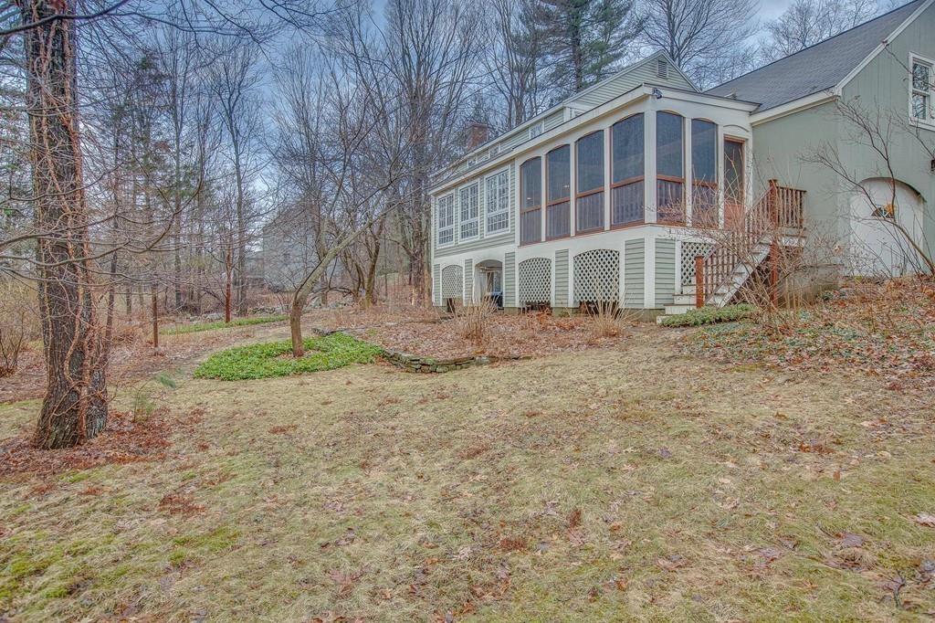 250 Old Littleton Road Harvard, MA 01451 - Photo 9 of 35 a front view of a house with a yard