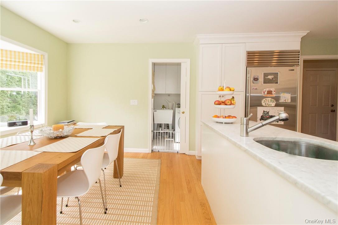 4 Dalphin Drive Rye, NY 10580 - Photo 9 of 24 Eat in area of kitchen with bay window and looking towards laundry area and door to patio and backyard