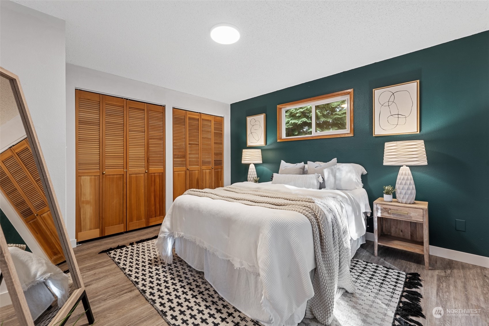 5408 25th Avenue Northwest Gig Harbor, WA 98335 - Photo 13 of 31 a bedroom with a bed and a window