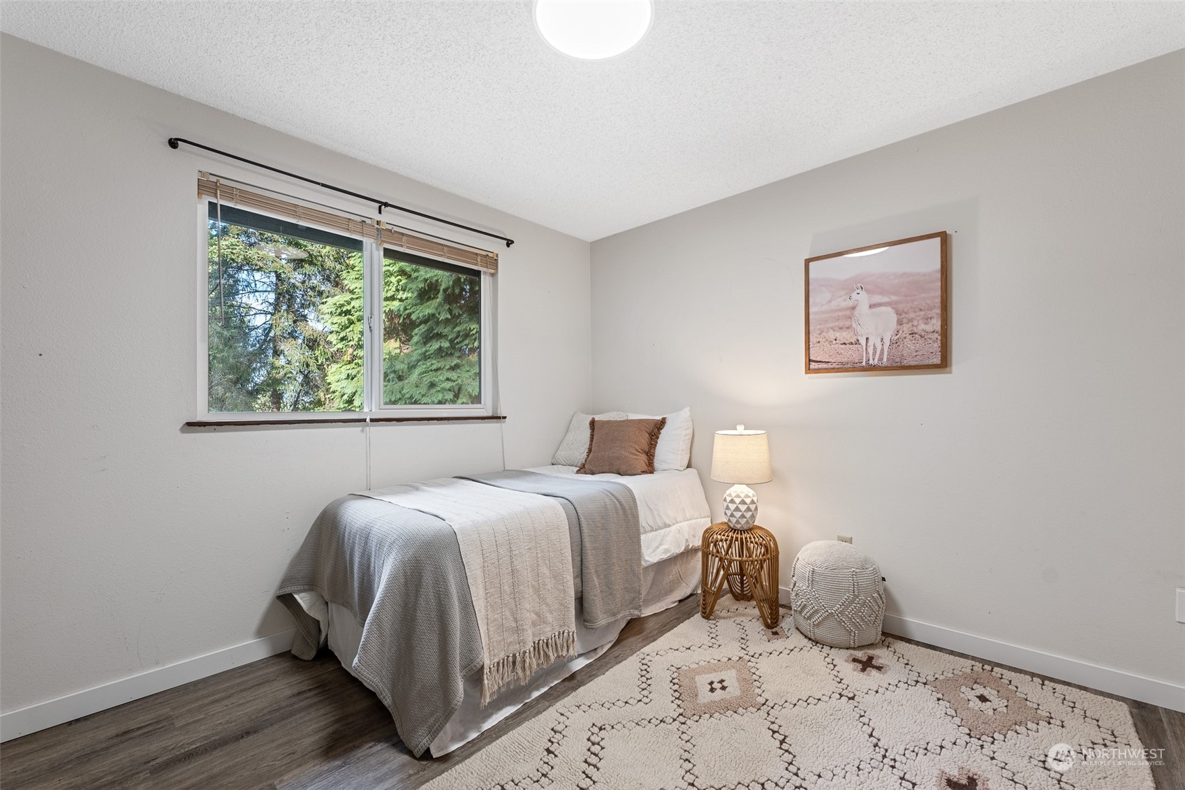 5408 25th Avenue Northwest Gig Harbor, WA 98335 - Photo 16 of 31 a bedroom with a bed and a window