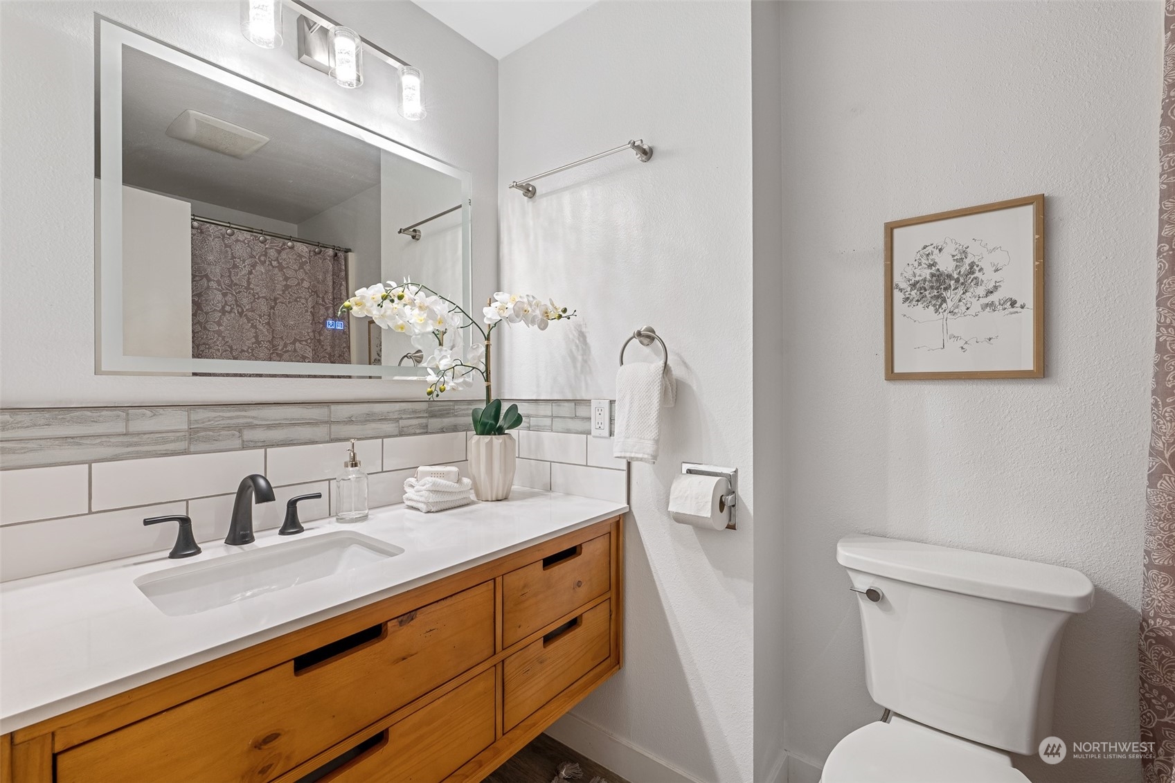 5408 25th Avenue Northwest Gig Harbor, WA 98335 - Photo 17 of 31 a bathroom with a sink a toilet and mirror
