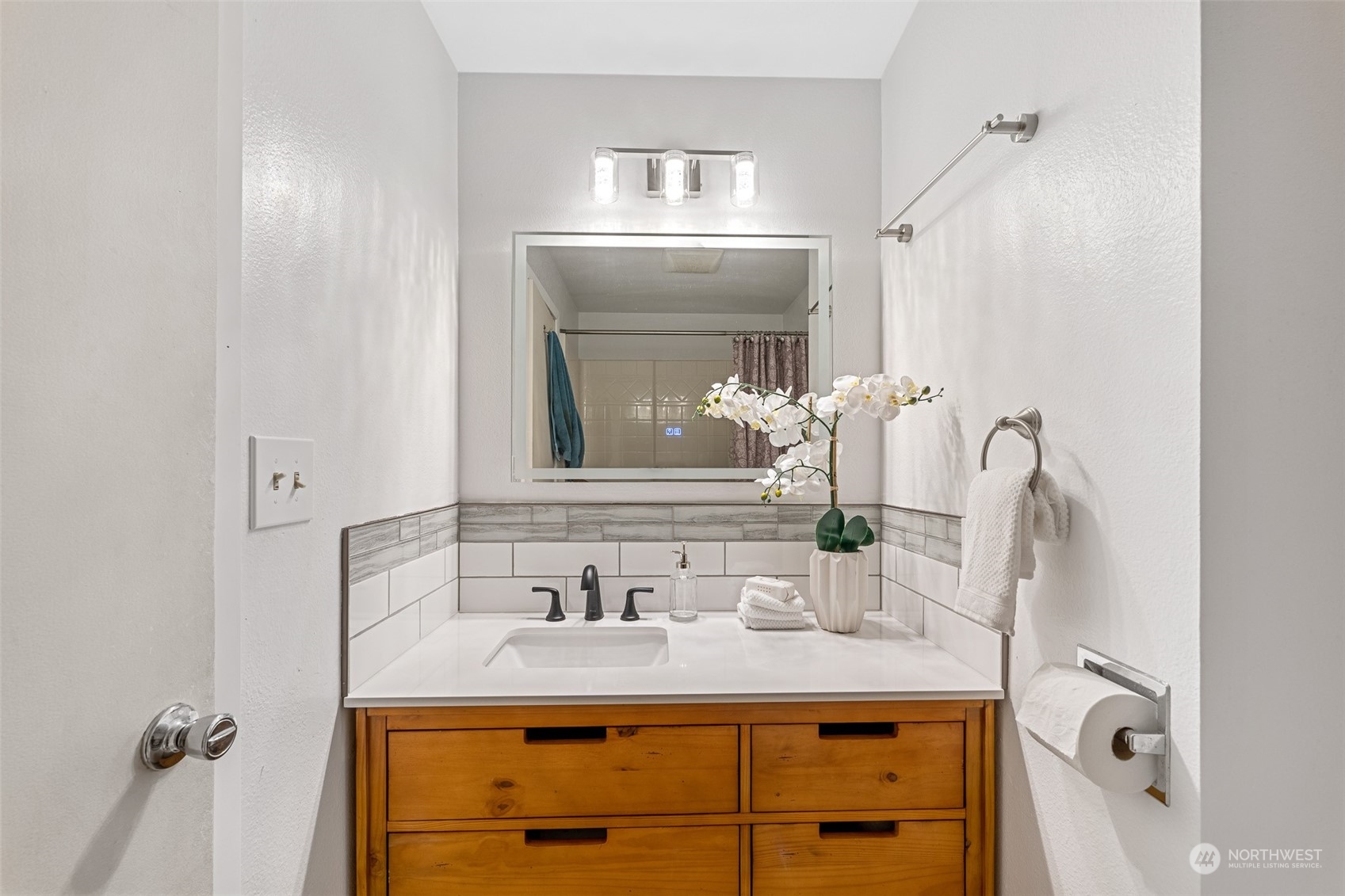 5408 25th Avenue Northwest Gig Harbor, WA 98335 - Photo 18 of 31 a bathroom with a sink and a mirror