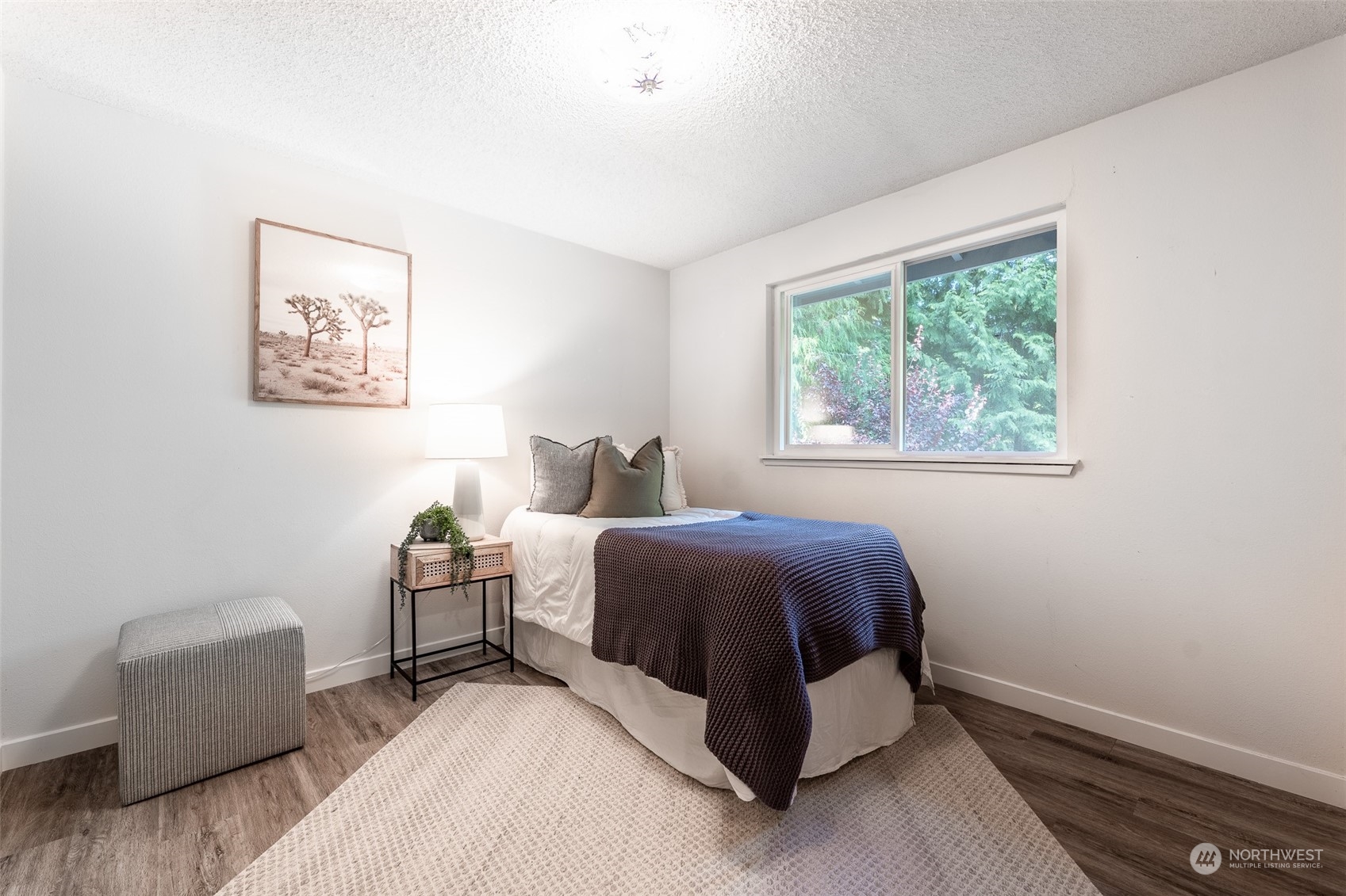 5408 25th Avenue Northwest Gig Harbor, WA 98335 - Photo 19 of 31 a spacious bedroom with a bed and a couch