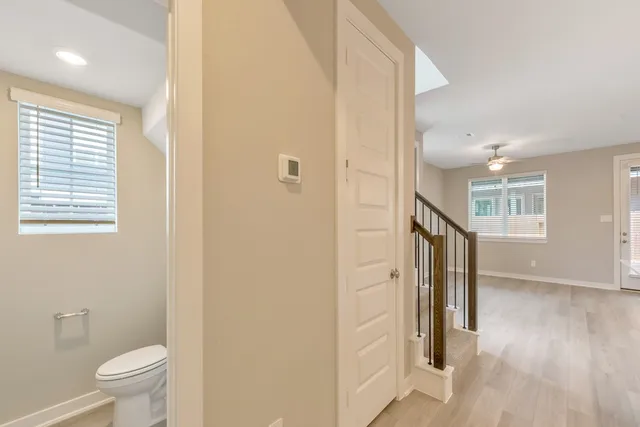 a bathroom with a toilet and a shower