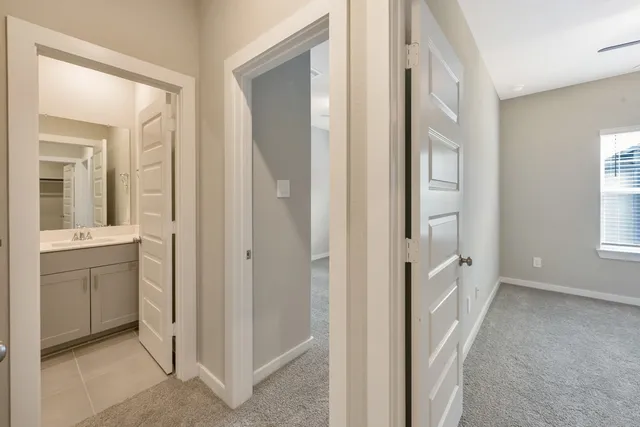 an empty room with ceiling fan