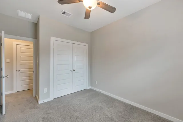 a view of a patio with a dining table and chairs with wooden floor