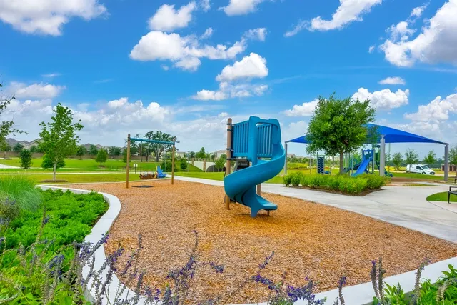 a view of a swimming pool and an outdoor space