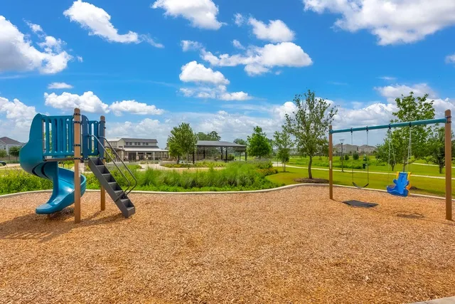 a view of a swimming pool with an outdoor space and seating area