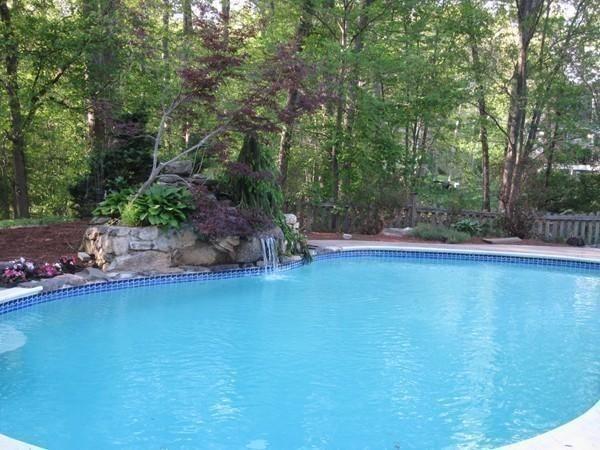 8 Pheasant Hill Road Bellingham, MA 02019 - Photo 11 of 15 a garden view with a seating space