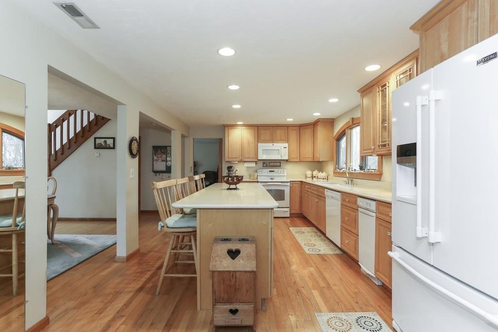 8 Pheasant Hill Road Bellingham, MA 02019 - Photo 4 of 15 a kitchen with a sink appliances and cabinets