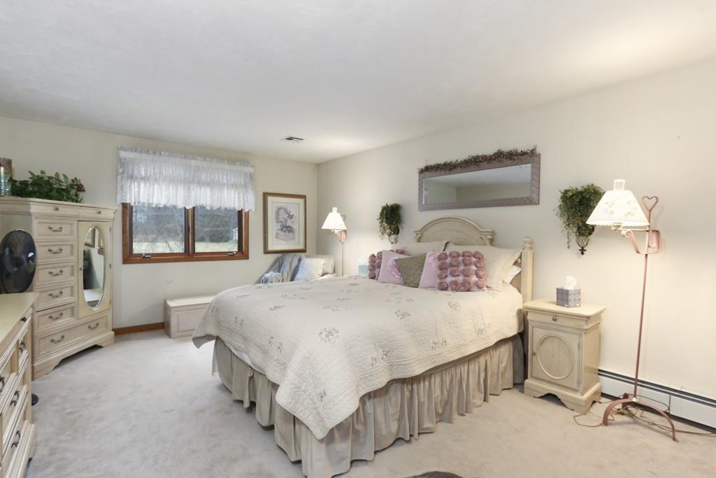 8 Pheasant Hill Road Bellingham, MA 02019 - Photo 7 of 15 a bedroom with a bed and a window