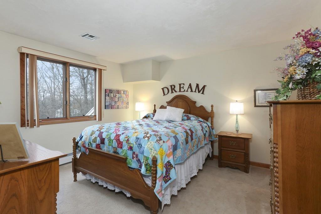 8 Pheasant Hill Road Bellingham, MA 02019 - Photo 9 of 15 a bedroom with a bed and a window