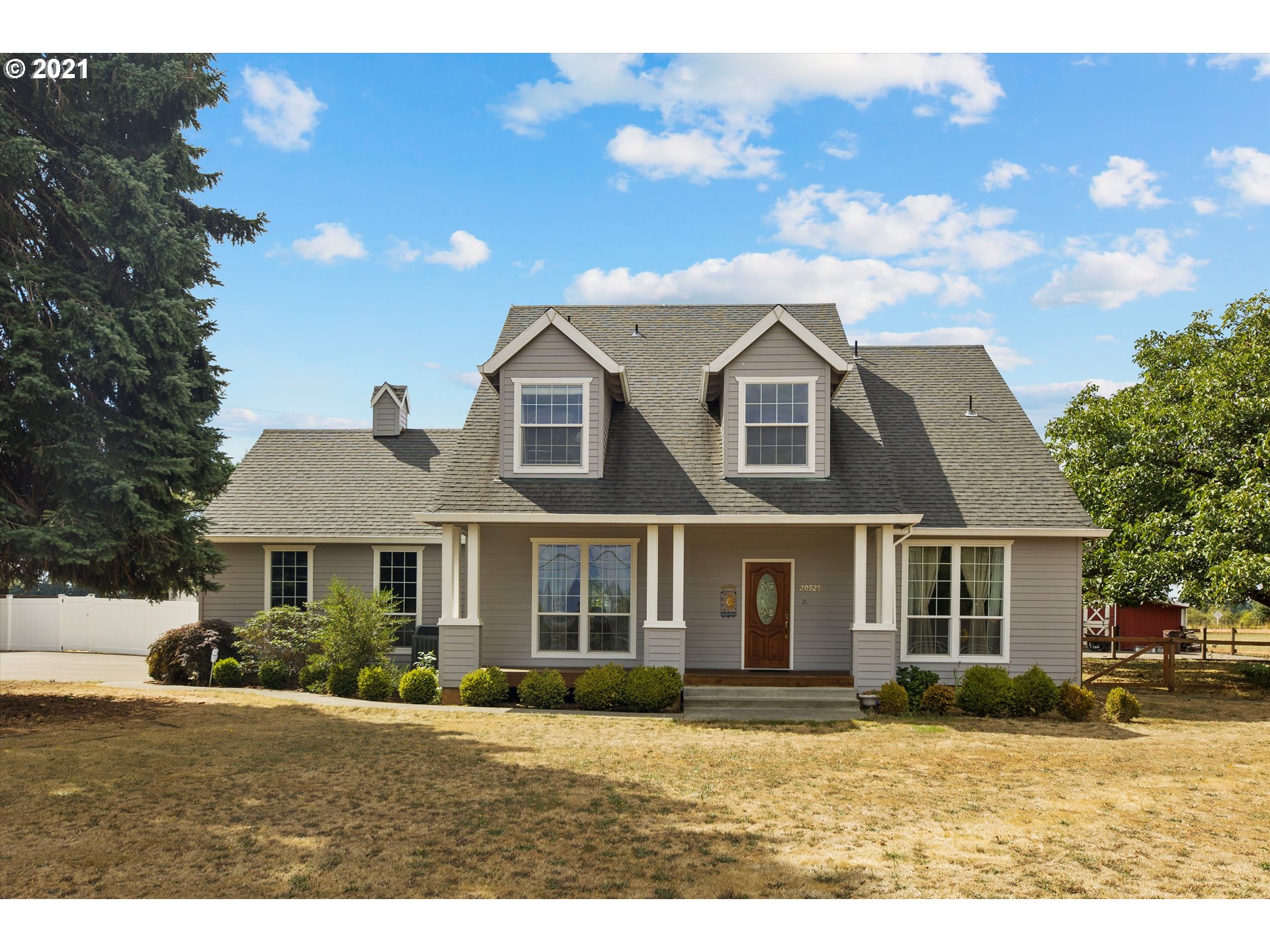 20925 South Ridge Road Oregon City, OR 97045 - Photo 1 of 32 a front view of a house with a yard