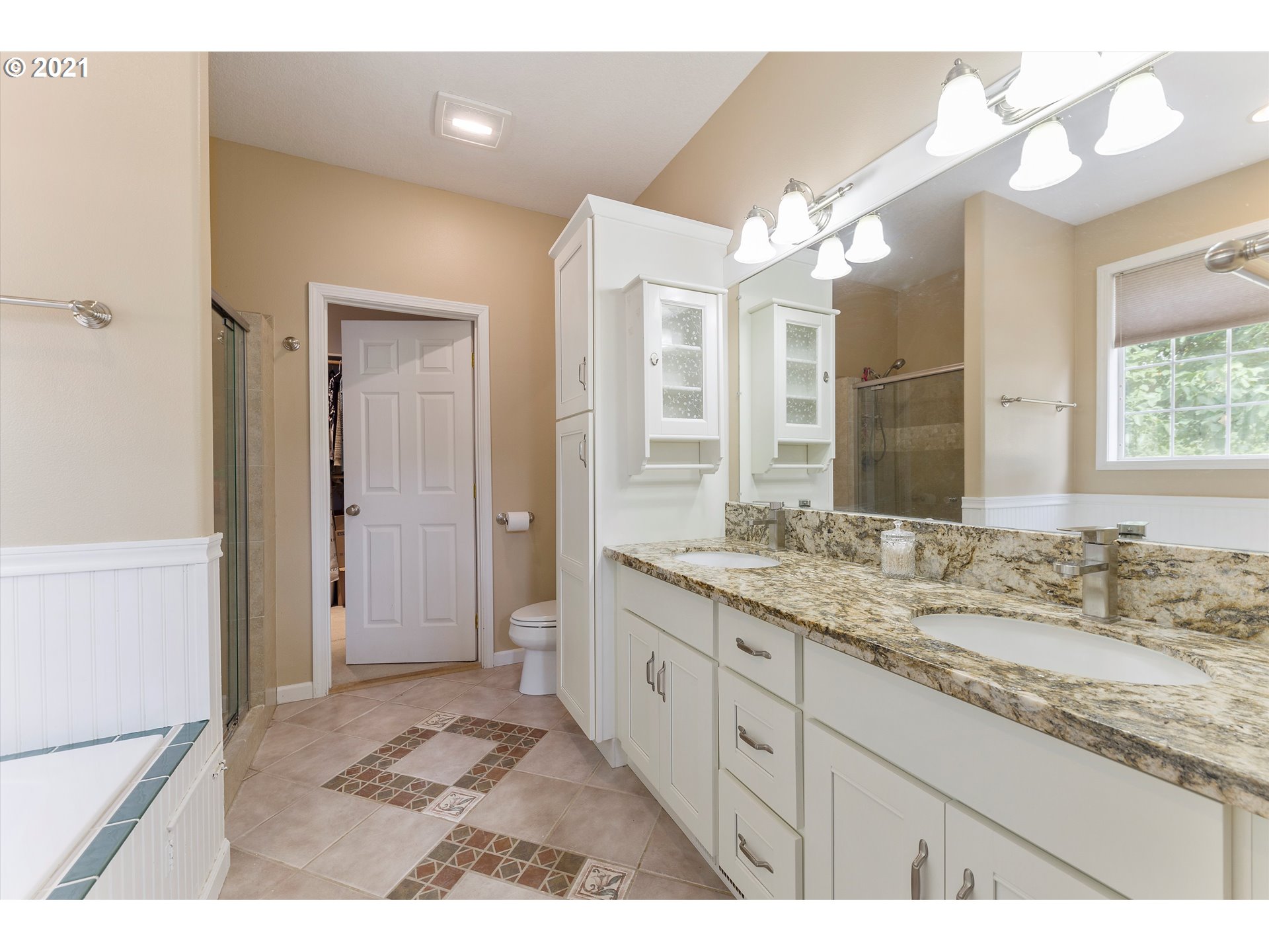 20925 South Ridge Road Oregon City, OR 97045 - Photo 17 of 32 a bathroom with a granite countertop sink a mirror and a shower