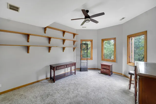 a view of a livingroom with furniture and a window