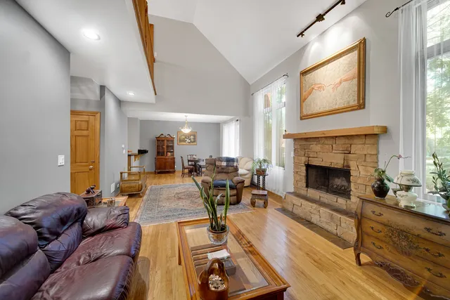a living room with furniture fireplace and window